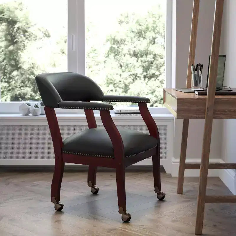 Black Vinyl Conference Chair with Nail Trim and Casters