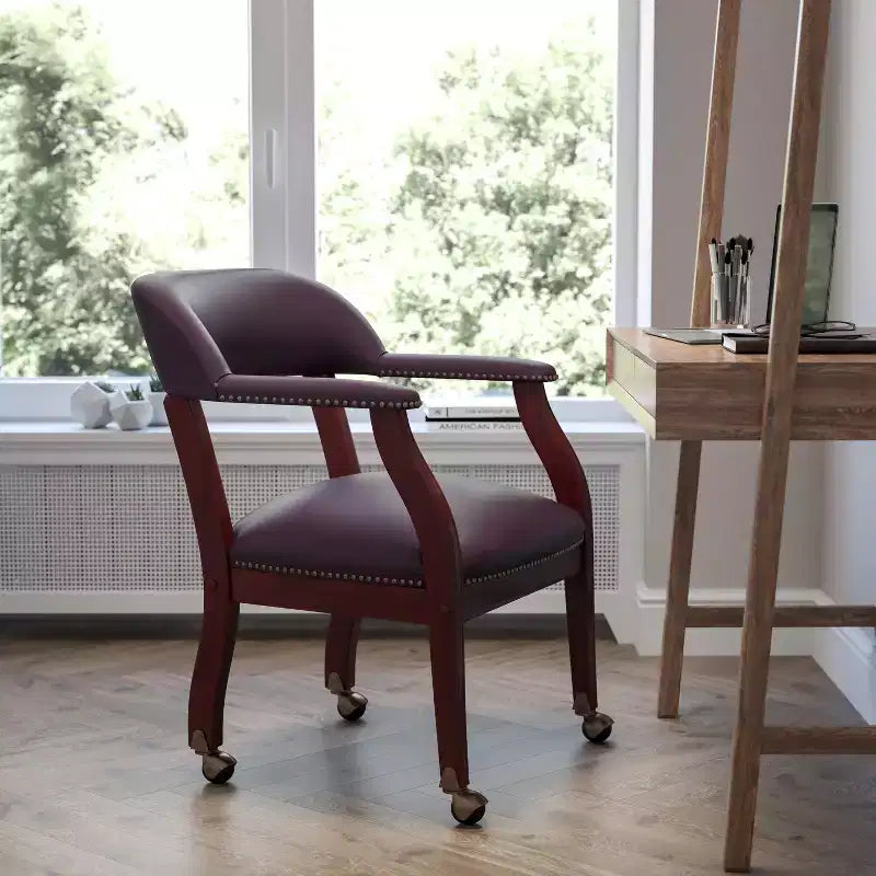 Black Vinyl Conference Chair with Nail Trim and Casters